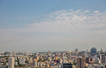 Kyiv aerial summer cityscape with flying military airplanes, Ukraine.