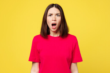 Young sad astonished indignant mag outraged woman she wear pink t-shirt casual clothes looking...