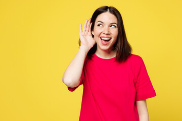 Young curious nosy cheerful happy woman she wear pink t-shirt casual clothes try to hear you...