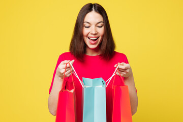 Young shocked happy excited exultant cool woman she wears pink casual clothes hold in hand open...