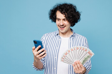 Young man he wears shirt white t-shirt casual clothes hold fan of cash money in dollar banknotes...