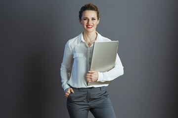 happy stylish woman worker isolated on grey background