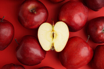 Fresh red apples on color background