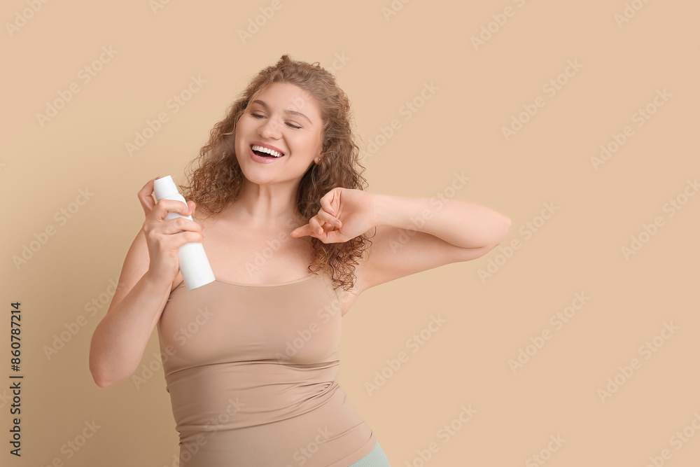 Poster Happy young woman with deodorant on beige background