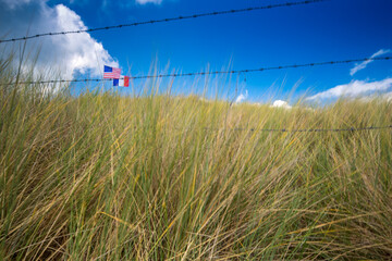 American And French Flags On Utah Beach, Normandy