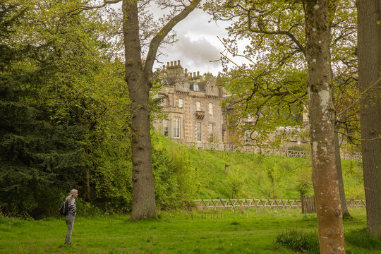 A visitor approaches Abbotsford, an historic country house near Galashiels in the Scottish Borders. It was home to famed author and poet Walter Scott from 1817 to 1825.