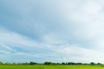 landscape scenery a meadow soil in a rice field Preparation of paddy field for sowing the rice seed with fluffy clouds blue sky daylight background.