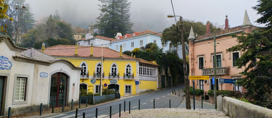 picturesque street scene in a historic city, with colorful buildings and ancient architecture,...