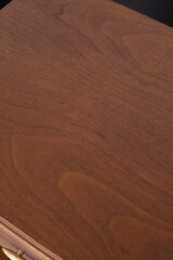 Naklejka premium Dark walnut wood grain texture. Vertical wood pattern banner photograph.