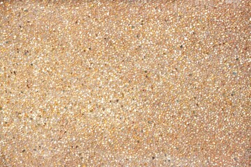 Background image: Red concrete floor strewn with small stones to look beautiful.