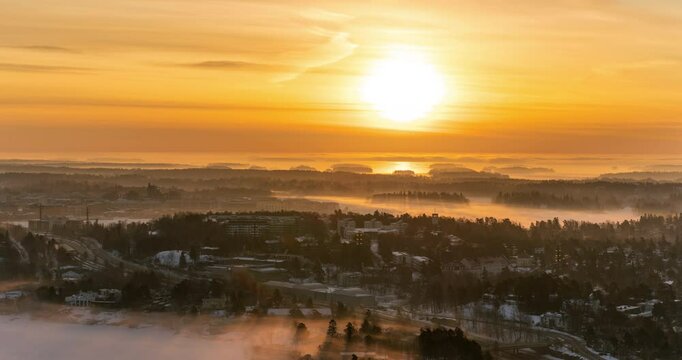 Time lapse of a foggy sunrise above the Kulosaari island, winter in Helsinki
