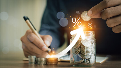 Businessman is calculating income and return on investment in percentage. Interest rate and dividend concept, income, return, retirement, compensation fund, investment, dividend tax, stock market