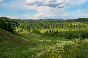 View of the Izborsko-Malskaya Valley and the village of Izborsk on a sunny summer day, Pechersk district, Pskov region, Russia