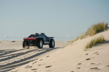 Obraz premium Black Off-Road Vehicle Driving on a Sandy Dune