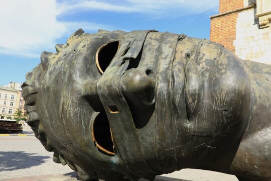 Eros Bendato Sculpture. It&rsquo;s the work of Igor Mitoraj and located in Krak&oacute;w&rsquo;s main square. Krakow, Poland - June 1