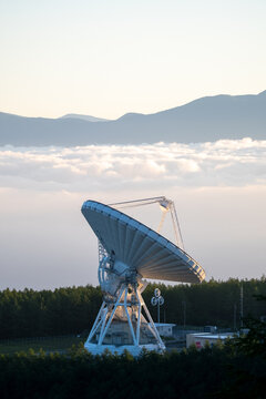 radio telescope at sunset