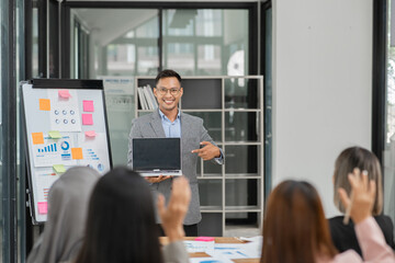 Group of business people meeting and present work on the board