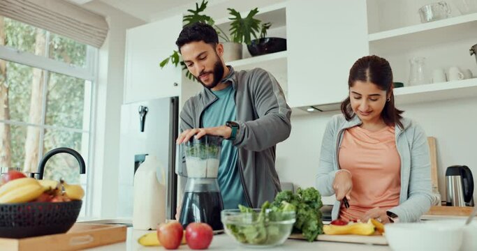 Blender, smoothie and couple with healthy food for diet, detox and breakfast drink in kitchen at home. Vegan nutritionist or man and woman helping with vegetables to prepare ingredients for juice