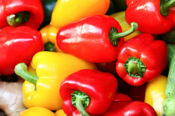 Red and yellow bell peppers are sold together. On Thai street food