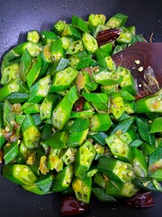 frying okra at home.this photo was taken from Bangladesh.