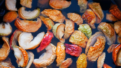 Close-up of dried colorful apples soaked in water for making compote