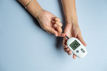 hand of people check diabetes and high blood glucose monitor with digital pressure gauge....