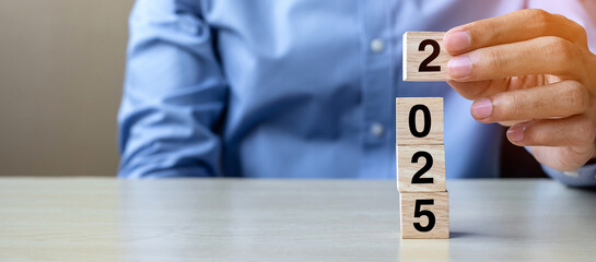 block 2025 text on table. Resolution, strategy, plan, goal, motivation, reboot, business and New...