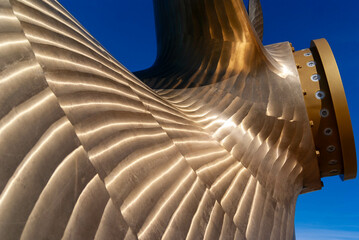 The shiny surface of a ship's propeller.