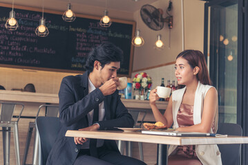 Young couple talking in cafe coffee shop happy date couple communication positive relationship...