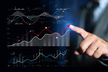 Businessman is pointing arrow graph corporate future growth plan. businessman analysing forex trading graph financial data, stock market. Business development to success motivation concept.