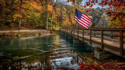 An American flag fluttering on a wooden bridge crossing a serene river, with autumn leaves creating a colorful landscape