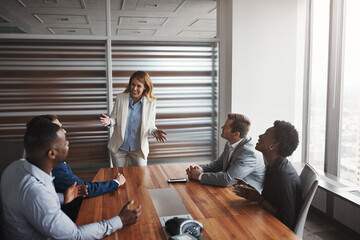 Business, presentation and woman speaker in office meeting with team for planning, discussion and...