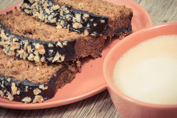 Fresh baked pastry made of zucchini and cup of white coffee. Delicious dessert