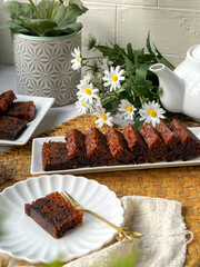 Kek Buah Kukus, a traditional Malaysian steamed fruit cake filled with dried fruits, nuts, and spices, enjoyed during celebrations.