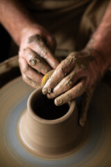 hands of a potter at work
