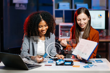  UX developer and ui designer brainstorming about mobile app interface wireframe design with...