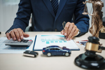 A man in a suit sells cars at his desk, offers online car insurance , car loans, comprehensive coverage, cash withdrawals via credit cards, and provides free legal consultations on automotive issues