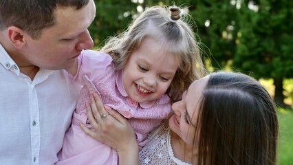 Little daughter Girl In Family Day with mother and father
