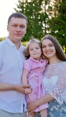 Fototapeta premium Happy Family in Fathers Day in summer park, Empowered Parenting