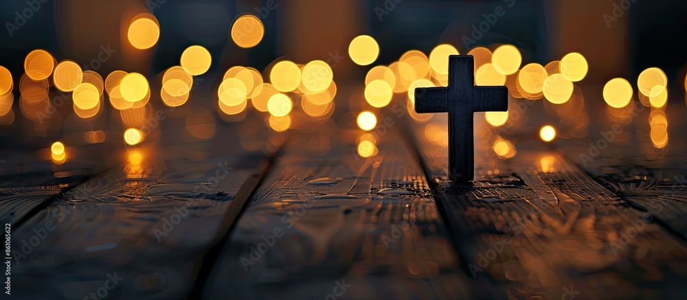 Poster Christian cross on the wooden floor with blurred lights background. with copy space image. Place for adding text or design