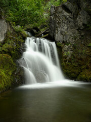 Fototapeta premium Waterfall in the forest in New Zealand, mysterious scene long exposure time