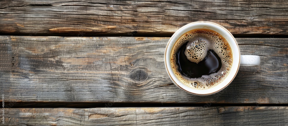 Poster Close-up of a cup of coffee on a wooden table. with copy space image. Place for adding text or design