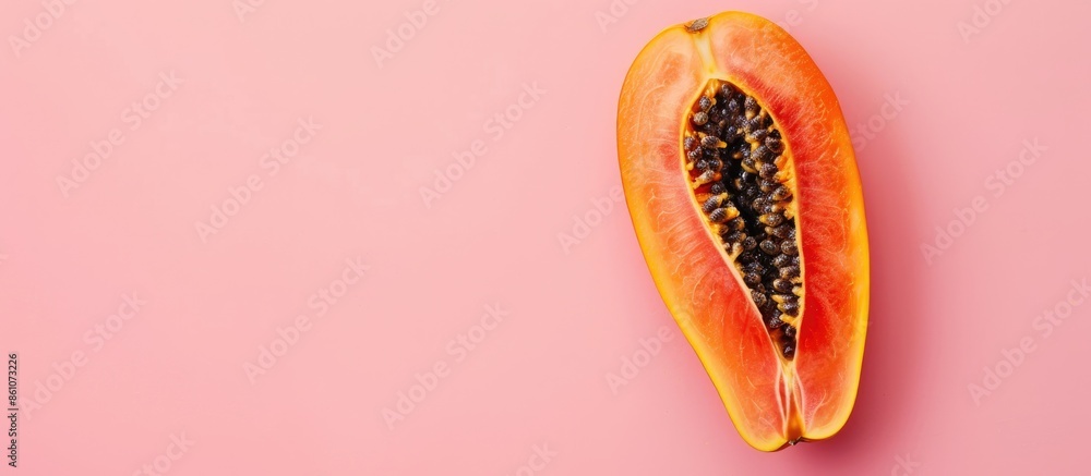 Leinwandbilder papaya slice isolated on pastel background, top view. with copy space image. place for adding text o