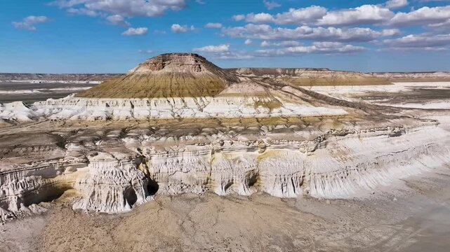Sor Tuzbair - in this place the breakage of the Ustyurt plateau sharply breaks off with a cascade of clay-limestone and chalk steps, in the base of which lies an extensive salt marsh. Kazakhstan.