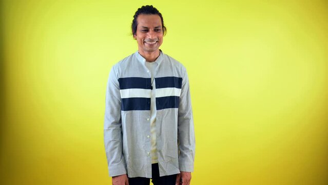 Man smiling with cunning expression