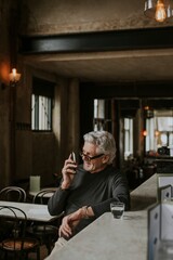 Man talking on the phone at a bar
