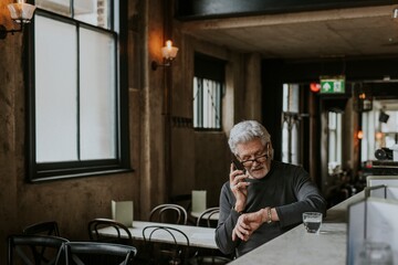 Senior man waiting at a restaurant