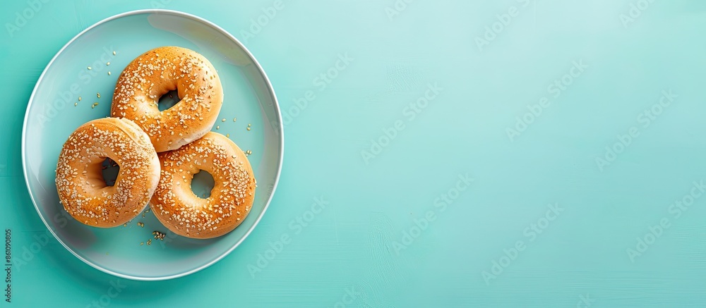 Canvas Prints Hot tasty bagel in the plate pastel background  Food. Copy space image. Place for adding text and design