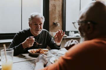 Old friends eating lunch at restaurant