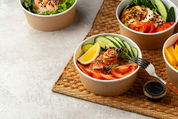 Fresh poke bowl on straw mat close up